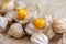 Physalis peruviana edible tasty physalis orange yellow fruits in dry husks on creased paper