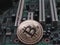 Physical bitcoin on computer motherboard