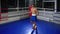 physical exercise for endurance and strength in training hall, young black man is skipping with rope