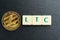 Physical Litecoin gold coin with letter tiles text