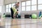 Physical therapist helping senior woman at gym