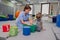 Physical therapist working with little girl in sensory room. Exercising for development of tactile sensations.