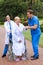 Physical therapists helping patient walk