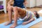 Physical therapy for kids, child doing a bridge with a physical therapist, core strengthening exercise