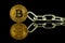 Physical version of Bitcoin virtual money and chain. Conceptual image for Blockchain Technology and hard fork
