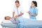 Physician assess sick patient in hospital