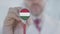 Physician uses stethoscope with the Hungarian flag. Healthcare in Hungary