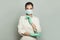 Physician woman in medical mask on white background. Medicine, cosmetology and vaccination concept