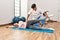 Physioterapist man giving treatment to woman at the clinic