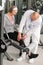 Physiotherapist assist active senior woman at gym