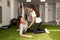 Physiotherapist assisting young caucasian woman with exercise wi