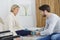 Physiotherapist caring lady leg in medical room