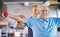 Physiotherapist, senior man and weight training for health and wellness therapy in retirement. Healthcare, physio and