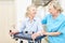 Physiotherapist and senior with rollator