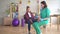 Physiotherapist tells a teenage girl with orthopedic problems about orthopedic insoles for flatfoot correction