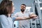 Physiotherapist working with little girl hand and shoulder in rehabilitation center closeup portrait