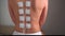 Physiotherapy of the back with TENS electrode pads, external electrical nerve stimulation