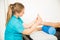 Physiotherapy Professional Massaging Patient`s Foot