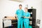 Physiotherapy Professionals With Clipboard Standing By Patient I