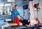 Physiotherapy. Suspension training therapy. Young man doing fitness therapy