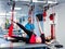 Physiotherapy. Suspension training therapy. Young woman doing fitness traction