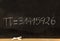 Pi number, mathematical constant chalk drawing on a school black board