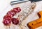 Piacenza salami cut in slices on a wooden surface, close-up