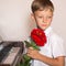 Pianist boy with a bouquet of flowers