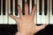 Pianist hand playing a chord.