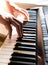 Pianist hand playing digital piano. Close-up. Music concept, learning to play the piano. Space for text.