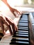 Pianist hand playing digital piano. Close-up. Music concept, learning to play the piano. Space for text.