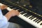 pianist man& x27;s hand playing piano. performer & classic music inst