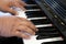 pianist man& x27;s hand playing piano. performer & classic music inst