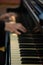 Pianist\\\'s hands in close-up while playing the piano. Piano keys during a classical music concert
