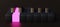 Piano keyboard with all black keys except one that is illuminated pink