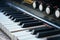 Piano keyboard background with selective focus. Piano, keyboard piano, side view of instrument musical tool