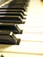 The piano keyboard with black and white keys and notes. Music and sound.