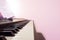 Piano keyboard with note. Pink color filter with light effect. C