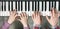 Piano Keyboard top View and Hands of Child and Mother