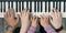 Piano Keyboard top View and Hands of Child Mother and Father