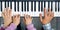 Piano Keyboard top View and Hands of Child Mother and Father