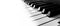 Piano Keys Fading into White Panorama Music