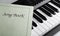 Piano keys and song book