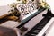 Piano with open keys decorated with a bouquet of white roses