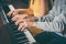 Piano players playing together four-handed