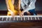 Piano teacher giving music lessons to his student