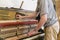 Piano tuning process. closeup of hand and tools of tuner working on grand piano. Detailed view of Upright Piano during a tuning