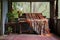 a piano on a verandah with a blanket draped over the bench