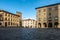 Piazza del Duomo, the main square of Pistoia historic center, Tuscany, Italy against a blue sky
