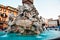 Piazza Navona in Rome, Italy, circa October 2019. Water flowing from the fountain. People walking in the square.